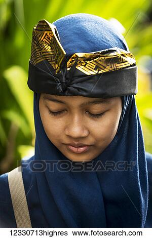 A Young Balinese Woman Poses At A Hindu Ceremony; Bali, Indonesia View Large Photo Image Stock Photograph - A Young Balinese Woman Poses At A Hindu Ceremony; Bali, Indonesia. Fotosearch
