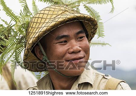 Actor dressed as a Pathet Lao soldier in traditional costume at Site 2, Plain of Jars; Xiangkhouang, Laos View Large Photo Image Stock Photograph - Actor dressed as a Pathet Lao soldier in traditional costume at Site 2, Plain of Jars; Xiangkhouang, Laos. Fotosearch