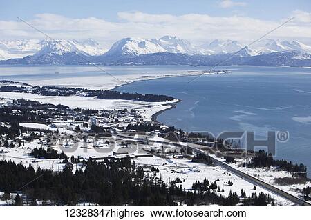Stock Photograph - Aerial Scenic Of Homer, Kachemak Bay, And Kenai Mountains In Winter, Southcentral Alaska, USA. Fotosearch