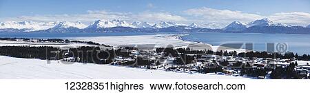 Stock Photograph - Aerial Scenic Of Homer, Kachemak Bay, And Kenai Mountains In Winter, Southcentral Alaska, USA. Fotosearch