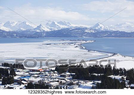 Stock Photograph - Aerial Scenic Of Homer, Kachemak Bay, And Kenai Mountains In Winter, Southcentral Alaska, USA. Fotosearch