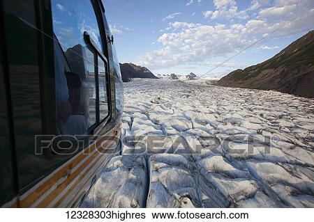 Stock Photograph - Aerial View Of A Helicopter Over Grewingk Glacier, Kachemak Bay State Park, Southcentral Alaska, USA. Fotosearch