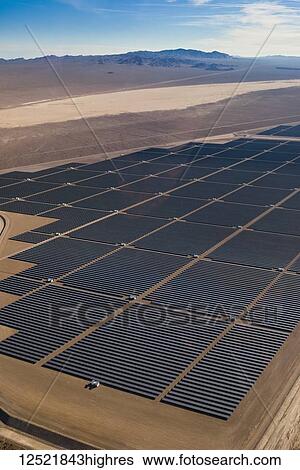 Stock Photograph - Aerial view of solar panels in a field in the desert; Las Vegas, Nevada, United States of America. Fotosearch