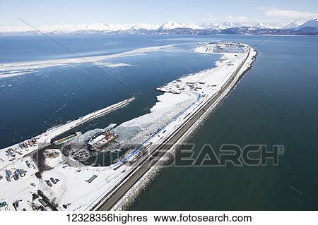 Stock Photograph - Aerial View Of The Homer Spit And Kenai Mountains In Winter, Southcentral Alaska, USA. Fotosearch