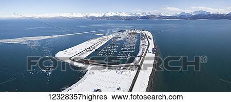 Stock Photograph - Aerial View Of The Homer Spit And Kenai Mountains In Winter, Southcentral Alaska, USA. Fotosearch