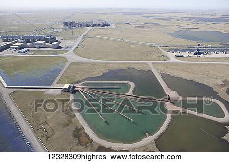 Stock Photograph - Aerial View, Oil Production, Pipeline, Prudhoe Bay Oil Field, North Slope, Alaska, Coastal Plane. Fotosearch