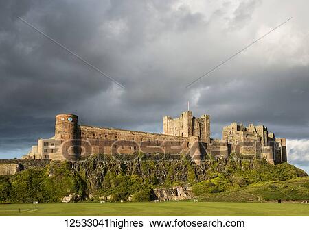 Stock Photograph - Ancient Bamburgh castle on 0rthumbrian coast; Bamburgh, 0rthumberland, England. Fotosearch