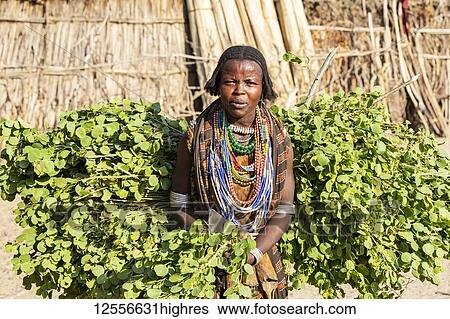 Stock Photograph - Arbore woman in Arbore Village, Omo Valley; Southern Nations Nationalities and Peoples' Region, Ethiopia. Fotosearch