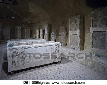 Stock Photograph - Austrian gunpowder storehouse, but today a Roman lapidarium with sarcofagi, sacrificial altars and tombstones; Belgrade, Vojvodina, Serbia. Fotosearch