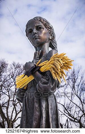 Stock Photograph - Bitter Memories of Childhood is a memorial statue on the Manitoba Legislative Grounds which pays tribute to the 1932-1933 Ukrainian Famine and Genocide under Soviet ruler Joseph Stalin; Winnipeg, Manitoba, Canada. Fotosearch