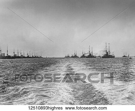 Black and white image of a wake in the ocean water from a nautical vessel and silhouetted ships View Large Photo Image Stock Photograph - Black and white image of a wake in the ocean water from a nautical vessel and silhouetted ships. Fotosearch