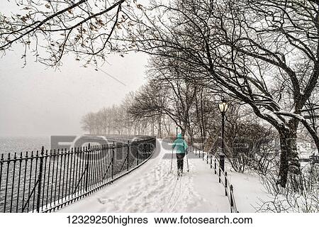 Stock Photograph - Blizzard Conditions By The Jacqueline Kennedy Onassis Reservoir, Central Park; New York City, New York, United States Of America. Fotosearch