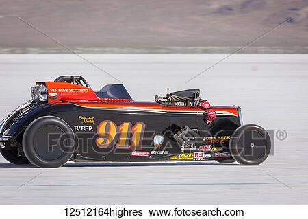 Stock Photograph - Blown Fuel Roadster Class B/BFR, a 1934 Ford Roadster with 424 Chrysler Hemi V-8 at speed trys to break 272. 056 mph record on Bonneville Salt Flats during Bonneville Speed Week 2017; Wendover, Utah, United States of America. Fotosearch