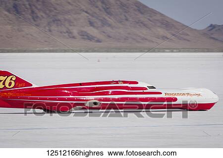 Stock Photograph - Blown Gas Streamliner Class F/BFS at speed trying to break 291. 673 mph record on Bonneville Salt Flats during Bonneville Speed Week 2017; Wendover, Utah, United States of America. Fotosearch