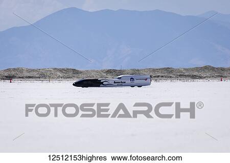 Stock Photograph - Blown Gas Streamliner Class F/BGS of Hardman Racing at speed attempting to break 291. 673 mph record on Bonneville Salt Flats during Bonneville Speed Week 2017; Wendover, Utah, United States of America. Fotosearch