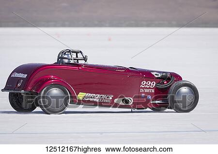 Stock Photograph - Blown Street Roadster Class D/BSTR a 1932 Ford Roadster with 4600cc Ford V-8 at speed attempting to break 229. 939 mph record on Bonneville Salt Flats during Bonneville Speed Week 2017; Wendover, Utah, United States of America. Fotosearch
