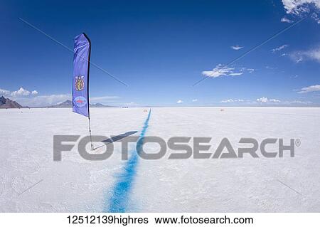 Stock Photograph - Blue line designating left side of track on Bonneville Salt Flats during Bonneville Speed Week 2017; Wendover, Utah, United States of America. Fotosearch