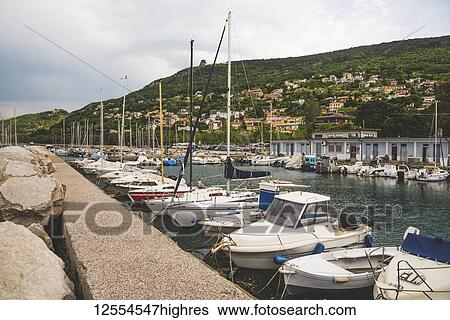 Stock Photograph - Boats moored in a harbour; Sistiana, Friuli Venezia Giulia, Italy. Fotosearch