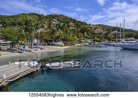 Stock Photograph - Boats moored in the harbour of Port Elizabeth; Port Elizabeth, Bequia, Saint Vincent and the Grenadines. Fotosearch