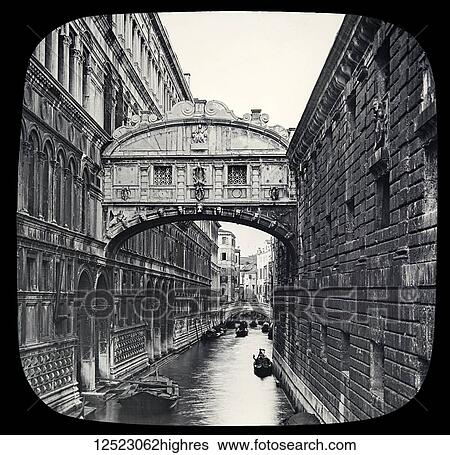 Stock Photograph - Bridge of Sighs along the Palace Canal and views of Doge's Palace. Venice, circa 1900 on a magic lantern slide, photographs created in 1888 by Joseph John William; Venice, Italy. Fotosearch