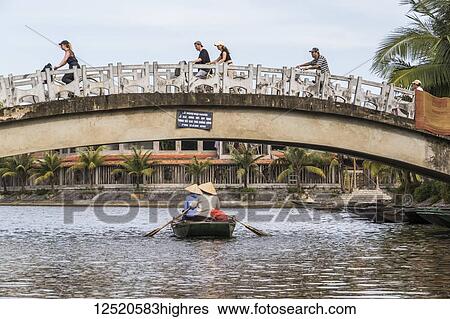 Stock Photograph - Bridge over the Ngo Dong River; Tam Coc, Ninh Binh, Vietnam. Fotosearch