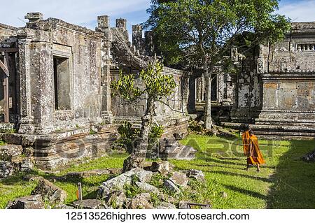 Stock Photograph - Buddhist monks in Gopura II; Preah Vihear, Cambodia. Fotosearch