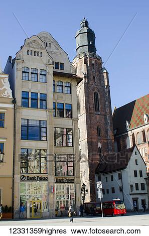 Buildings In The City Centre With Red Electric Minibus, Bank Pecao And Church Of St. Elizabeth; Wroclaw, Poland View Large Photo Image Stock Photograph - Buildings In The City Centre With Red Electric Minibus, Bank Pecao And Church Of St. Elizabeth; Wroclaw, Poland. Fotosearch