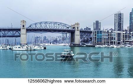 Burrard Street Bridge and a view of Granville Island with boats in False Creek; Vancouver, British Columbia, Canada View Large Photo Image Stock Photograph - Burrard Street Bridge and a view of Granville Island with boats in False Creek; Vancouver, British Columbia, Canada. Fotosearch