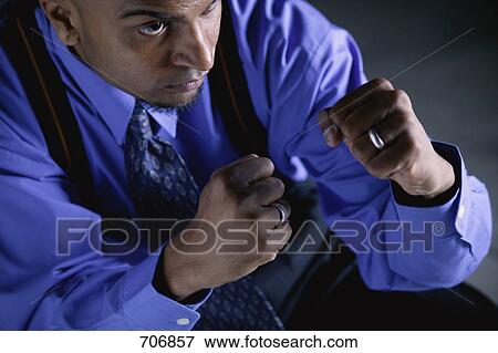 Stock Photo - Businessman with fists raised. Fotosearch