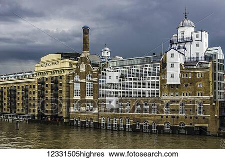 Butler's Wharf, built between 187173 as a shipping wharf and warehouse complex, has been transformed into luxury apartments, with restaurants and shops on the ground floor; London, England View Large Photo Image Stock Photograph - Butler's Wharf, built between 187173 as a shipping wharf and warehouse complex, has been transformed into luxury apartments, with restaurants and shops on the ground floor; London, England. Fotosearch