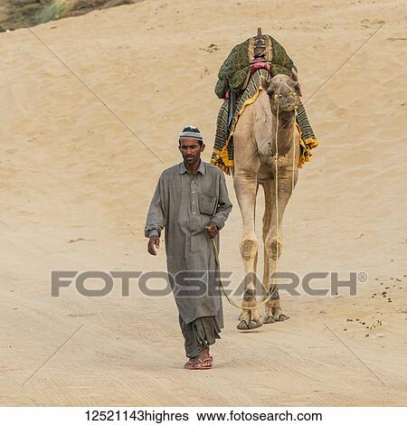 Camel safari on the Lakhmana Dunes, India View Large Photo Image Stock Photograph - Camel safari on the Lakhmana Dunes, India. Fotosearch
