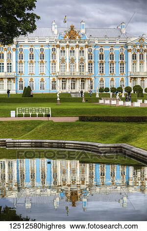 Stock Photograph - Catherine Palace reflected in water in a garden; Tsarskoye Selo, Pushkin, Russia. Fotosearch