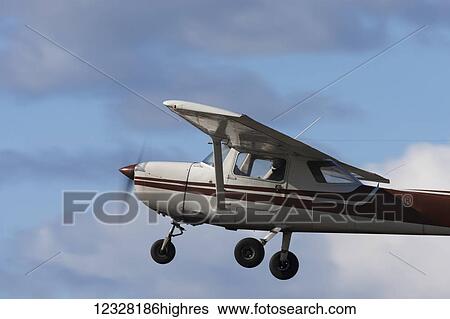 Stock Photograph - Cessna 150 In Flight At Merrill Field, Anchorage, Southcentral Alaska, USA. Fotosearch