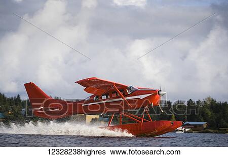 Stock Photograph - Cessna 206 Stationair Floatplane Landing, Alaska, USA. Fotosearch