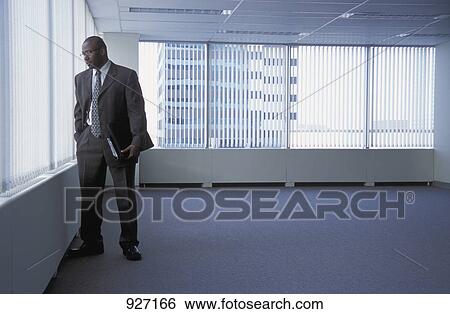 Choosing a new office building View Large Photo Image Stock Photograph - Choosing a new office building. Fotosearch