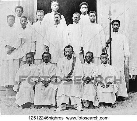 Stock Photograph - Christian missionaries posing, society for the propagation of the gospel in foreign parts, missionary work in Madagascar, circa 1900, Magic lantern slide; Madagascar. Fotosearch