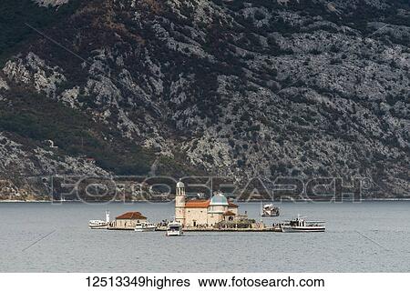 Stock Photograph - Church of Our Lady of the Rocks on the islet in the Bay of Kotor; Perast, Kotor Municipality, Monte. Fotosearch