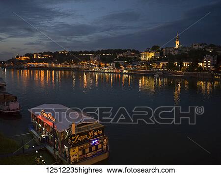 Cityscape of Belgrade illuminated with lights at night along the Danube River; Belgrade, Vojvodina, Serbia View Large Photo Image Stock Photograph - Cityscape of Belgrade illuminated with lights at night along the Danube River; Belgrade, Vojvodina, Serbia. Fotosearch