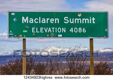 Stock Photograph - Close up of the Maclaren Summit sign, Denali Highway, Interior Alaska; Alaska, United States of America. Fotosearch