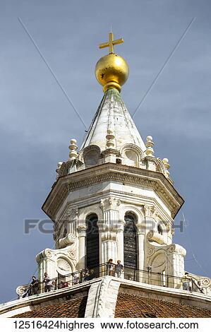 Close-up of the top part of dome of Cathedral of Santa Maria del Fiore with viewing platform and gold globe with cross; Florence, Tuscany, Italy View Large Photo Image Stock Photograph - Close-up of the top part of dome of Cathedral of Santa Maria del Fiore with viewing platform and gold globe with cross; Florence, Tuscany, Italy. Fotosearch