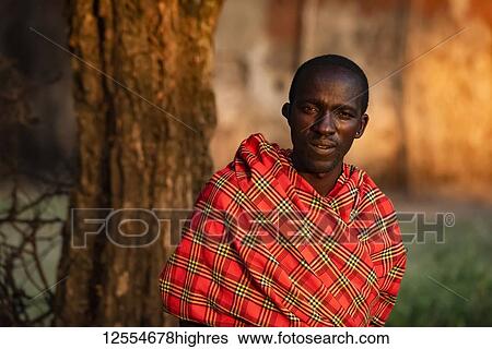 Close-up portrait of Masai man in shuka by tree; Tanzania View Large Photo Image Stock Photograph - Close-up portrait of Masai man in shuka by tree; Tanzania. Fotosearch