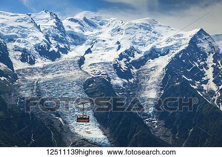 Close view of Mont Blanc and Brevent cable car under blue sky; Chamonix-Mont-Blanc, Haute-Savoie, France View Large Photo Image Stock Photograph - Close view of Mont Blanc and Brevent cable car under blue sky; Chamonix-Mont-Blanc, Haute-Savoie, France. Fotosearch