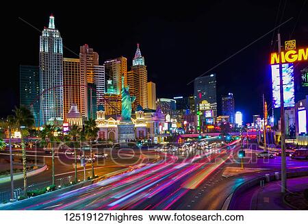 Stock Photograph - Colourful lights illuminate Las Vegas architecture and roadways at night; Las Vegas, Nevada, United States of America. Fotosearch