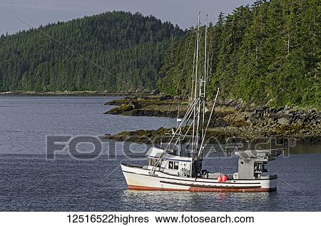 Stock Photograph - Commercial fishing boat in Auke Bay near Juneau, Southeast Alaska; Alaska, United States of America. Fotosearch