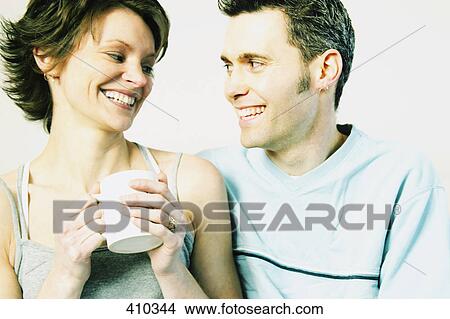 Couple enjoy morning company View Large Photo Image Picture - Couple enjoy morning company. Fotosearch