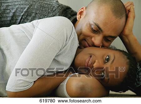 Stock Image - Couple snuggles. Fotosearch