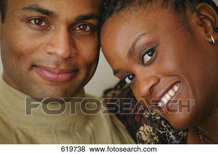 Stock Photo - Couple touching heads. Fotosearch