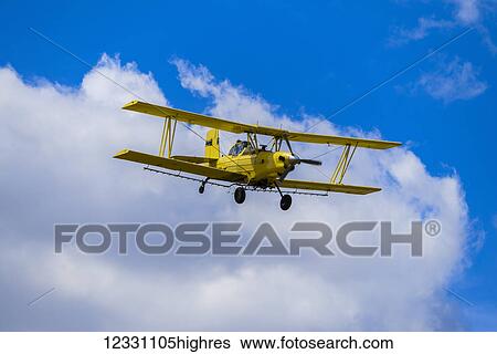 Stock Photograph - Crop Duster Spraying Herbicide On Fields Of Garbanzo Beans In The Palouse Region Of Eastern Washington; Washington, United States Of America. Fotosearch