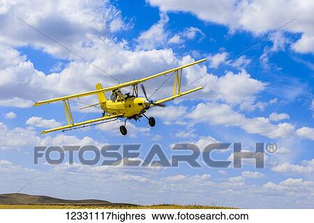 Crop Duster Spraying Herbicide On Fields Of Garbanzo Beans In The Palouse Region Of Eastern Washington; Washington, United States Of America View Large Photo Image Stock Photograph - Crop Duster Spraying Herbicide On Fields Of Garbanzo Beans In The Palouse Region Of Eastern Washington; Washington, United States Of America. Fotosearch