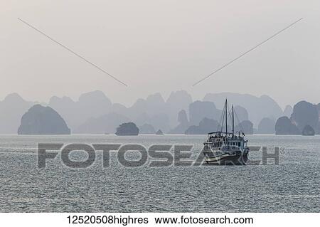 Cruise boat in Ha Long Bay; Quang Ninh, Vietnam View Large Photo Image Stock Photograph - Cruise boat in Ha Long Bay; Quang Ninh, Vietnam. Fotosearch